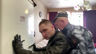 Team a few cops collar guy in suit and spit piss and molestation him